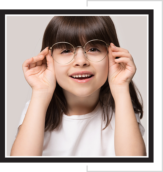 A young girl wearing glasses, which can help treat conditions like myopia.
